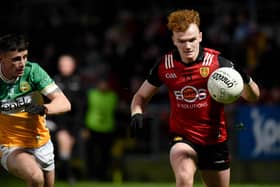 Down's Danny Magill takes on Offaly's Dylan Hyland at Pairc Esler on Saturday night. BM01