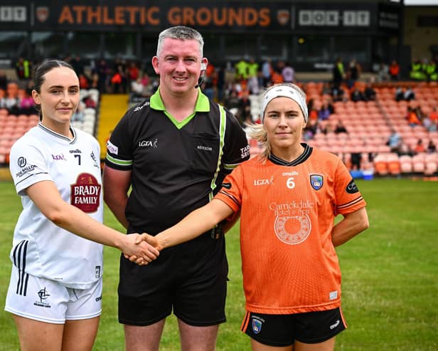 4 July 2026; Referee Anthony Marron, centre, is joined by Kildare captain Laoise Lenehan, left, and Armagh captain Lauren McConville ahead of the LGFA TG4 All-Ireland Senior Championship quarter-final match between Armagh and Kildare at BOX-IT Athletic Grounds in Armagh. Photo by Shauna Clinton/Sportsfile