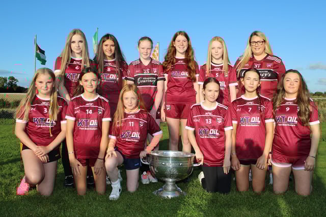 Under 13 and Under 15 Tomás Dáibhis Girls Team with the Sam Maguire Cup. INNR351