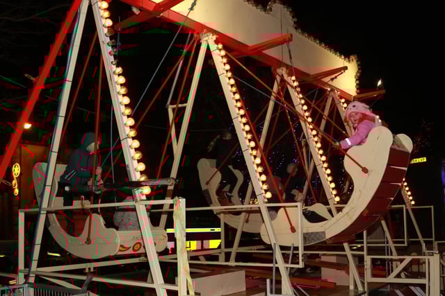 Flying high in the swing boats in Crossmaglen Square while waiting for Santa Claus to arrive. INNR4958