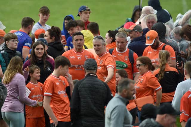 The Armagh supporters crowd around Stefan Campbell following their Championship win over Galway in 2023.