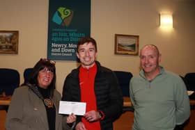 Chairperson Newry, Mourne and Down Council, Councillor Valerie Harte and Councillor Michael Ruane at the presentation of a cheque to Ryan McAleenan who leaves on Friday 17th November to join 50 leading GAA Stars in planting 1 million trees in Africa. INNR4800