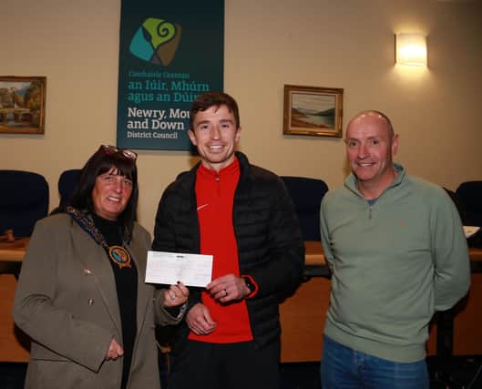Chairperson Newry, Mourne and Down Council, Councillor Valerie Harte and Councillor Michael Ruane at the presentation of a cheque to Ryan McAleenan who leaves on Friday 17th November to join 50 leading GAA Stars in planting 1 million trees in Africa. INNR4800