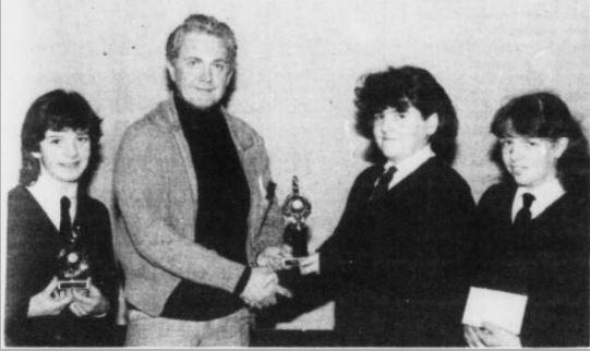 The Junior winners at the Inter-Class Public Speaking Competition: first, Marguerite McStay (centre), second, Catriona Farrell (left); audience prize, Kathleen Farrell (right).