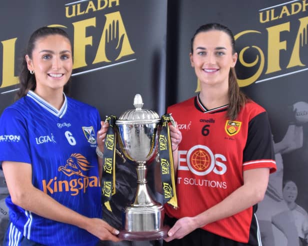 Team captains Shauna Lynch (Cavan) and Clara Mulvenna (Down) pose with the Ulster LGFA Intermediate Football Championship trophy.