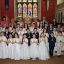 Teresa Crimmins Vice Principal, Olivia Gordon Teacher, Emma Taylor, Fr. Des Mooney, Jody Mussen Principal, Caitlin Clarke and the pupils from St. Bronagh's Primary School who received the Sacrament of First Holy Communion. INNR1527