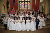 Teresa Crimmins Vice Principal, Olivia Gordon Teacher, Emma Taylor, Fr. Des Mooney, Jody Mussen Principal, Caitlin Clarke and the pupils from St. Bronagh's Primary School who received the Sacrament of First Holy Communion. INNR1527