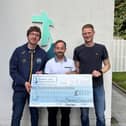 Ally McKenzie and Marshall Patterson with James McCaffrey (centre) of Southern Area Hospice Services.