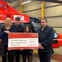 Members of the Nummy family make a contribution of £19,928 to Air Ambulance NI.