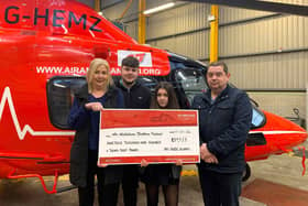 Members of the Nummy family make a contribution of £19,928 to Air Ambulance NI.