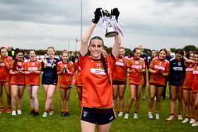 8 June 2025; Armagh captain Gemma Marsden lifts the cup after the LGFA All-Ireland U14 Bronze Final match between Limerick and Armagh at Coralstown/Kinnegad GAA in Westmeath. Photo by Ben McShane/Sportsfile