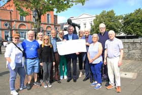 Trustees of Newry Gateway Willie McGivern, John McSherry and Paddy Duffy MBE along with committee members accepted a cheque form Pat Jennings for £3,000 INNR3145