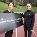 Ciara Mageean, with Minister Liz Kimmins, encourages road users to take more care as she signs up to the Department for Infrastructure’s Share the Road to Zero campaign.