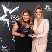 Emma Kearney accepts the award for Hair/Beauty Influencer of the Year from Linda Stinson of Bellamianta. 