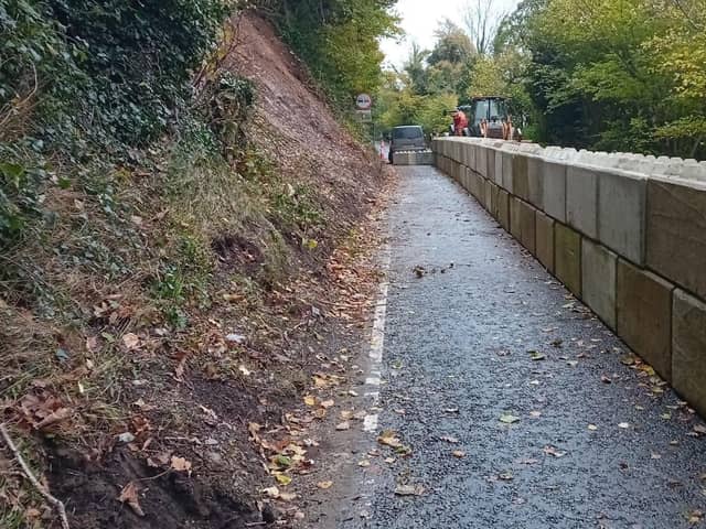 The Shore Road between Killowen and Rostrevor with concrete blocks put in place by DfI following a landslip in November 2023. Credit: Cllr Michael Rice.