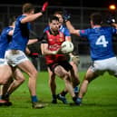 Down's James Guinness finds himself surrounded by Cavan Players at Pairc Esler during their recent Dr McKenna Cup clash.