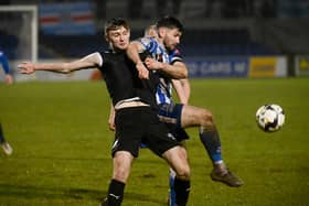 Newry City's Darren King battles with Ballymena United's Noah Stewart during their game in December.