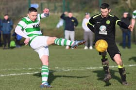Newry Celtic's Keith Johnston takes a shot against Cleary Celtic