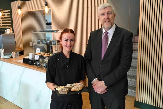 Finance Minister John O’Dowd MLA with City Sips Café owner Caoimhe Meehan.