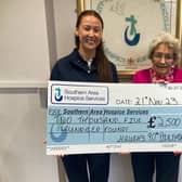 Maura is photographed presenting the cheque to Fundraising Officer Alison Donaghy.
