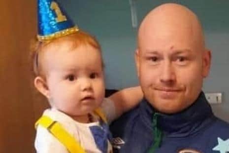 Harry celebrating his first birthday with his dad Ciaran.