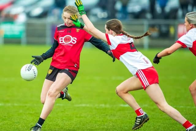 Down U16 player Clodagh Simpson takes a shot at the posts against Derry.