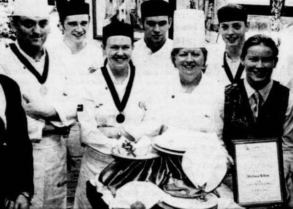 Staff and students from Newry and Kilkeel Institute of Further and Higher Education's School of Hospitality and Tourism photographed with their collection of medals and awards from IFEX 2002.