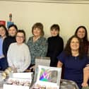 Staff at McShanes with Mrs Maureen Fegan as she marked her retirement.