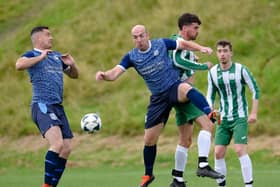 Mayobridge midfielder Miceal Lively contests a high ball with Greenfield Captain James Boyd at Derrybeg Pictures: Brendan Monaghan BM01