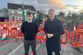 Mourne Cllr Michael Rice and South Down MP Chris Hazzard, pictured at the recent closure in Kilkeel, are requesting a full safety review of the A2 from Newcastle to Warrenpoint.