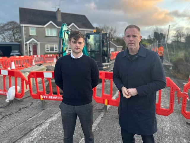 Mourne Cllr Michael Rice and South Down MP Chris Hazzard, pictured at the recent closure in Kilkeel, are requesting a full safety review of the A2 from Newcastle to Warrenpoint.