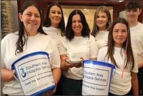 Pictured are the Morgan family, mum Aine and children Aimee, Erinn, Katie, Eoghan and Annie who are walking in memory of their late father Gene Morgan.