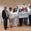 PIPS CEO Seamus McCabe receives a cheque from St Catherine's Dominican Church