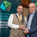 Chairperson Councillor Pete Byrne presents Dominic Quinn with a Civic Award in the Community And Voluntary Category for his services to Saval GAC.