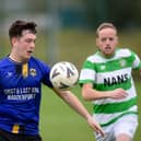 Millburn's Ronan Fegan controls the ball as Celtic's Shane King closes in at Dromalane on Saturday. Pic: Brendan Monaghan