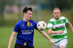 Millburn's Ronan Fegan controls the ball as Celtic's Shane King closes in at Dromalane on Saturday. Pic: Brendan Monaghan
