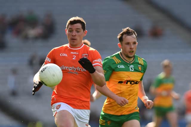 Armagh's Paddy Burns gets away from Donegal's Aaron Doherty.