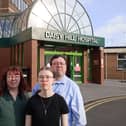 Liam Reichenberg with his wife Siobhan, and their 14-year-old daughter Aoife, standing outside Daisy Hill Hospital where the teenager was born. Credit: family photograph