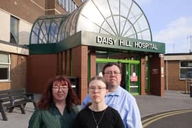 Liam Reichenberg with his wife Siobhan, and their 14-year-old daughter Aoife, standing outside Daisy Hill Hospital where the teenager was born. Credit: family photograph