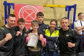 Gardai Kate Patterson who presented the medals with the boxers and coaches, pictured with Daniel McGuinness.