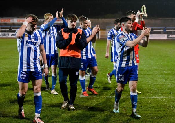 Newry City players applaud the fans on their way off the pitch. Pic: Brendan Monaghan