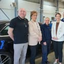 Minister Liz Kimmins with DVA's head of testing operations Donna O'Brien and staff of Lisburn MOT Centre who she has thanked for helping to deliver front-line services.