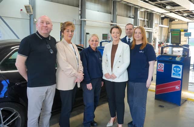 Minister Liz Kimmins with DVA's head of testing operations Donna O'Brien and staff of Lisburn MOT Centre who she has thanked for helping to deliver front-line services.