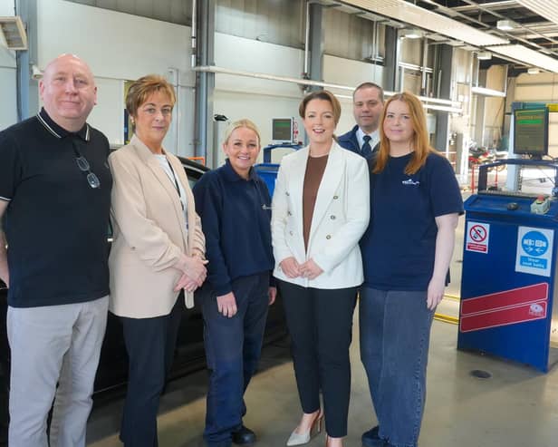 Minister Liz Kimmins with DVA's head of testing operations Donna O'Brien and staff of Lisburn MOT Centre who she has thanked for helping to deliver front-line services.
