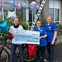 Elaine presenting £15,000 cheque to Hospice staff.