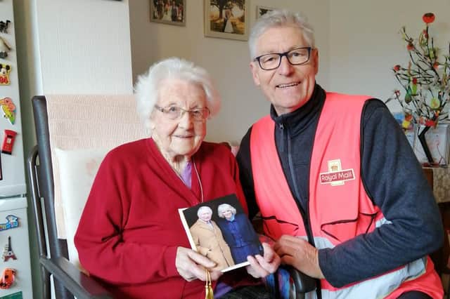 Mary and local postman Marty McDonald, delivering the King and Queen's birthday message.