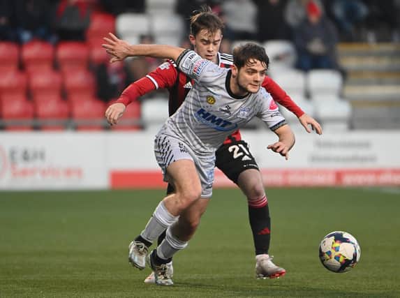 Crusaders' Mal Smyth in action with Newry’s Lorcan Forde. Pic: Inpho/Stephen Hamilton