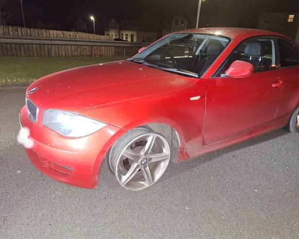 The car which was discovered with a missing tyre.