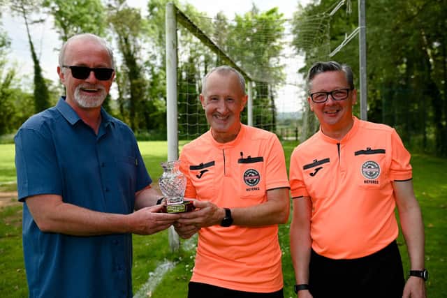Artie Ryan presents the Carnbane Referee of the year award to Paul McLoughlin also pictured is Rodney Kimbley. Pictures: Brendan Monaghan