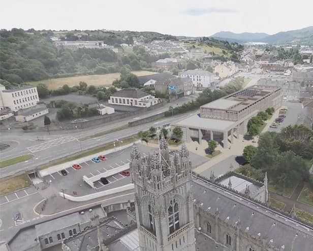 An image of Newry Cathedral and an artist's impression of the new NMDDC Civic Hub. (Image from NMDDC website)